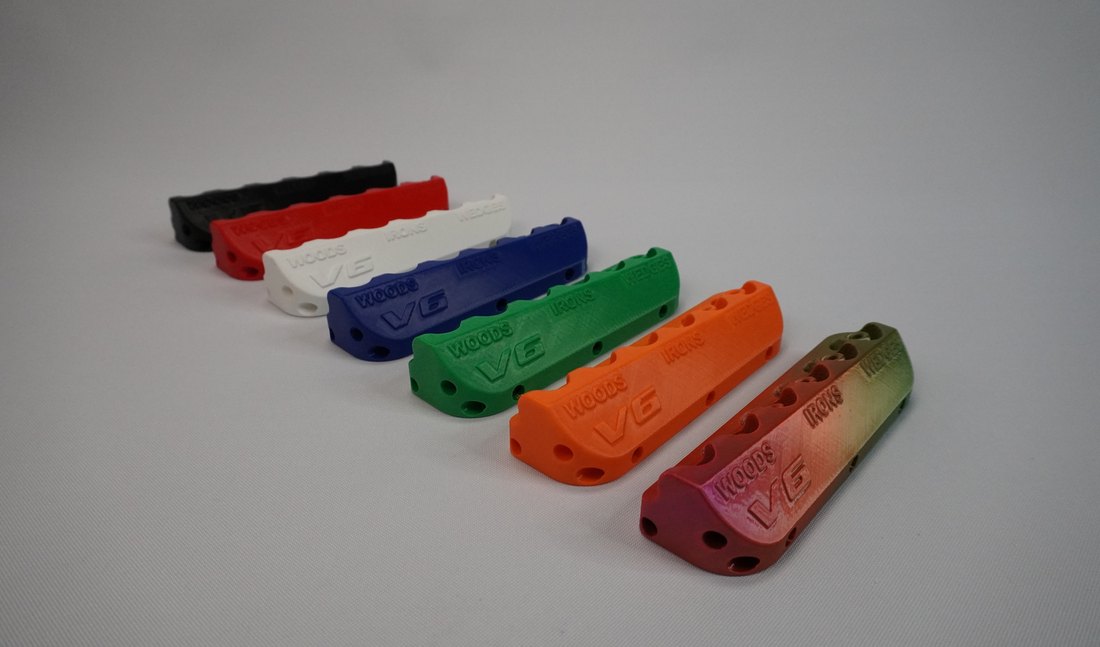 The V6 in all seven colors: black, red, white, blue, green, orange and rainbow