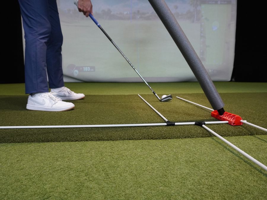 An alignment stick running from the V6 straight toward the target